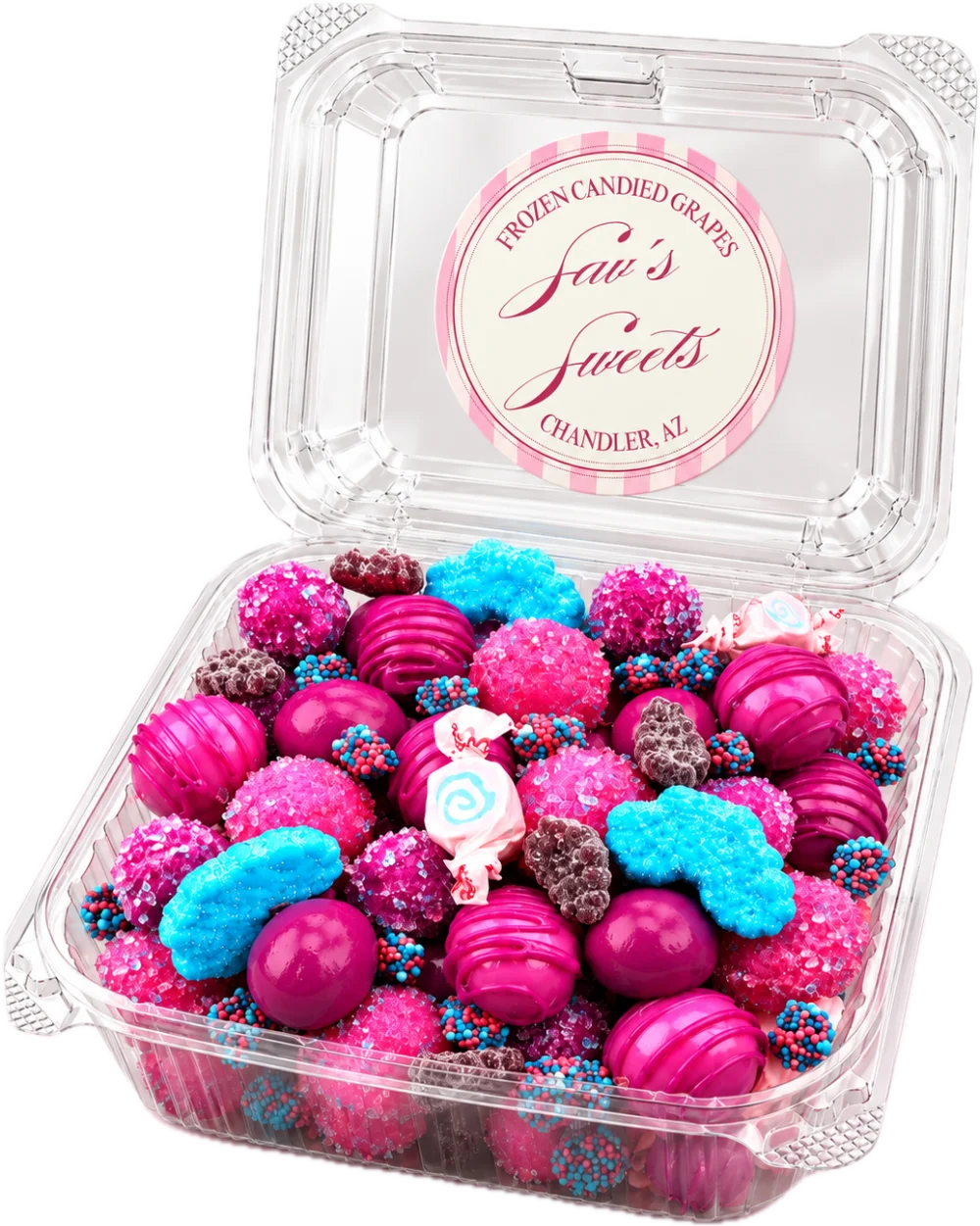 An open clear tray of hot pink candied grapes with blue sour belts and Nerds clusters, with the Sav's Sweets sticker on the lid